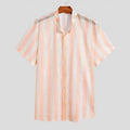 Men's pink loose-fit waffle-textured short-sleeve cardigan shirt on a hanger.