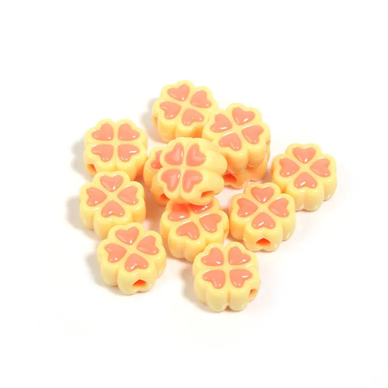 Assortment of 15mm frosted acrylic four-leaf clover beads in pink, yellow, green, blue, purple, and rose red.