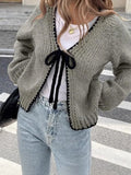 Solid colour lace-up cardigan with crocheted flowers on a polyester loose-fit body for women