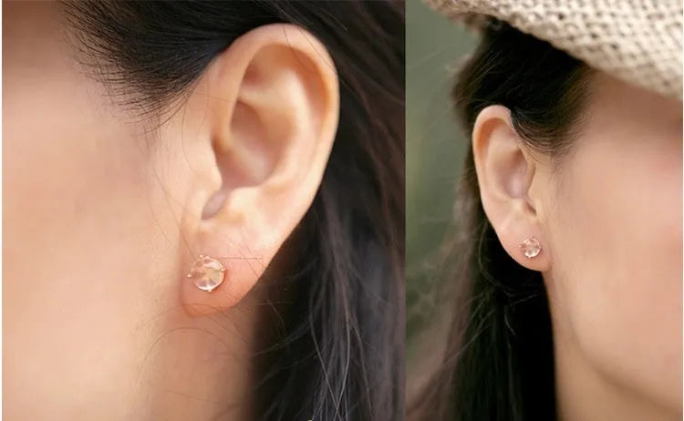 Rose gold coloured drop shaped stud earrings for women with a synthetic quartz stone.