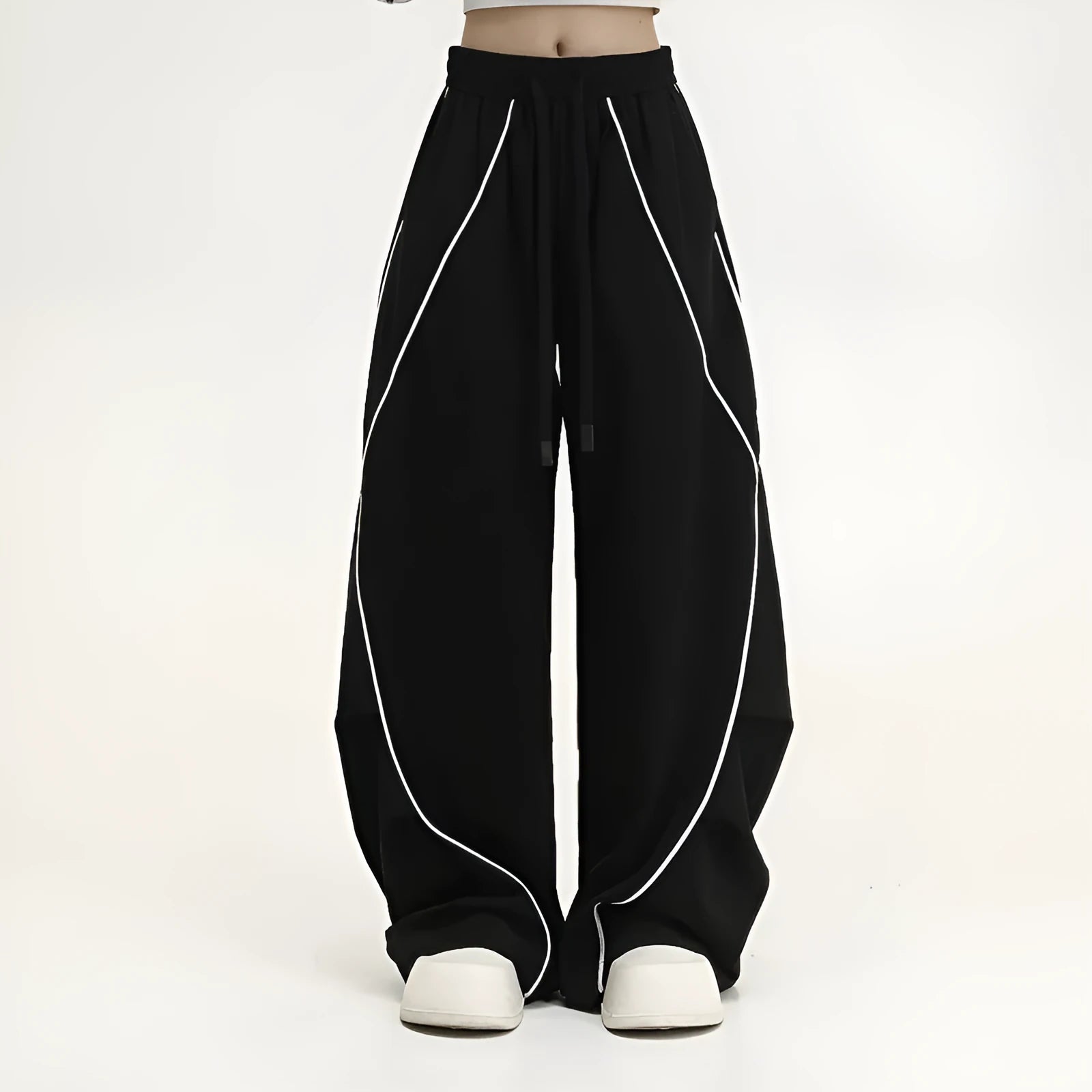 Black pleated hip hop sports pants with stripe pattern showing wide-leg design and mid-waist fit