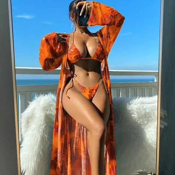 Two-piece banded bikini set with split long sleeve blouse and matching robe for swimming