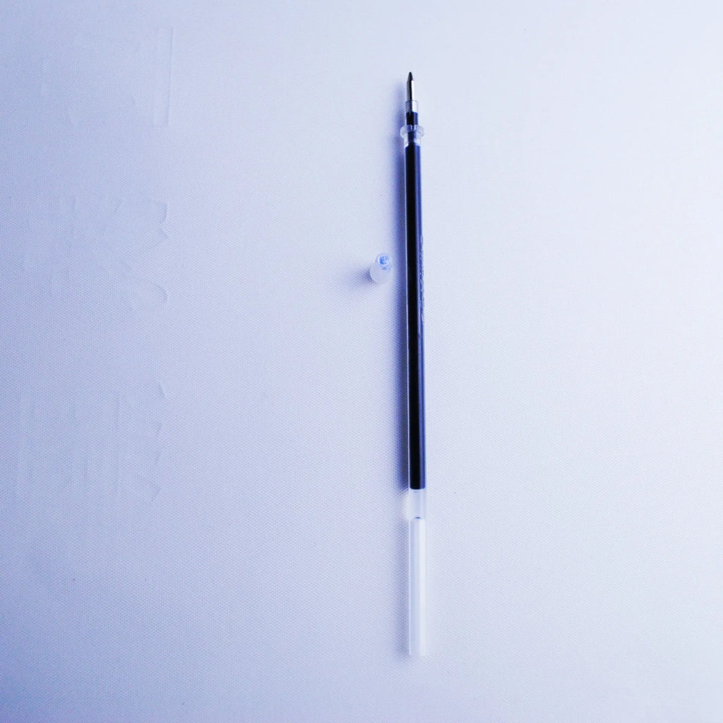 Blue automatic fading pen set with 0.5mm tip, eight refills, and plastic holder on white background