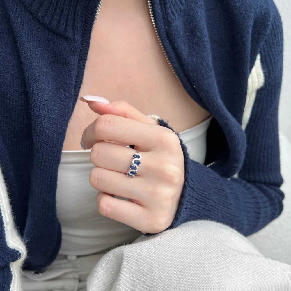 S925 sterling silver oval twisted ring with zircon inlay on white background, women geometric silver ring