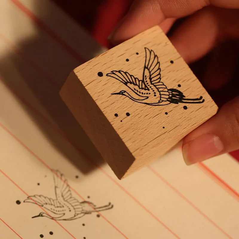 Mr. Paper wooden stamp set with four crane designs on a white background