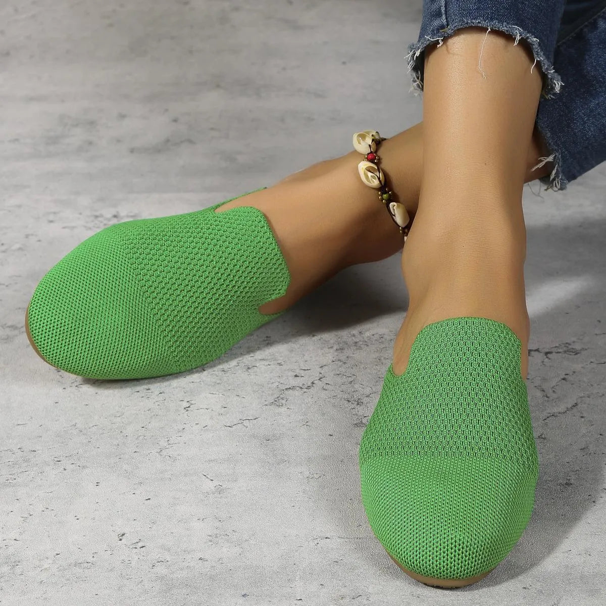 Mesh slip-on flat sandals in apricot, blue, and green colours showing round toe and rubber sole.