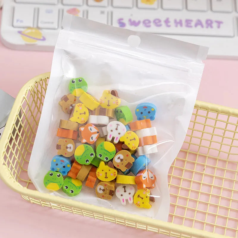 50 small colourful cartoon novelty erasers including fruit and animal shapes in a pearlescent film bag.