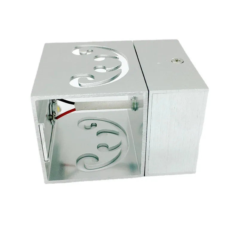 Modern aluminium butterfly-shaped LED wall lamp with remote control for colour changing.