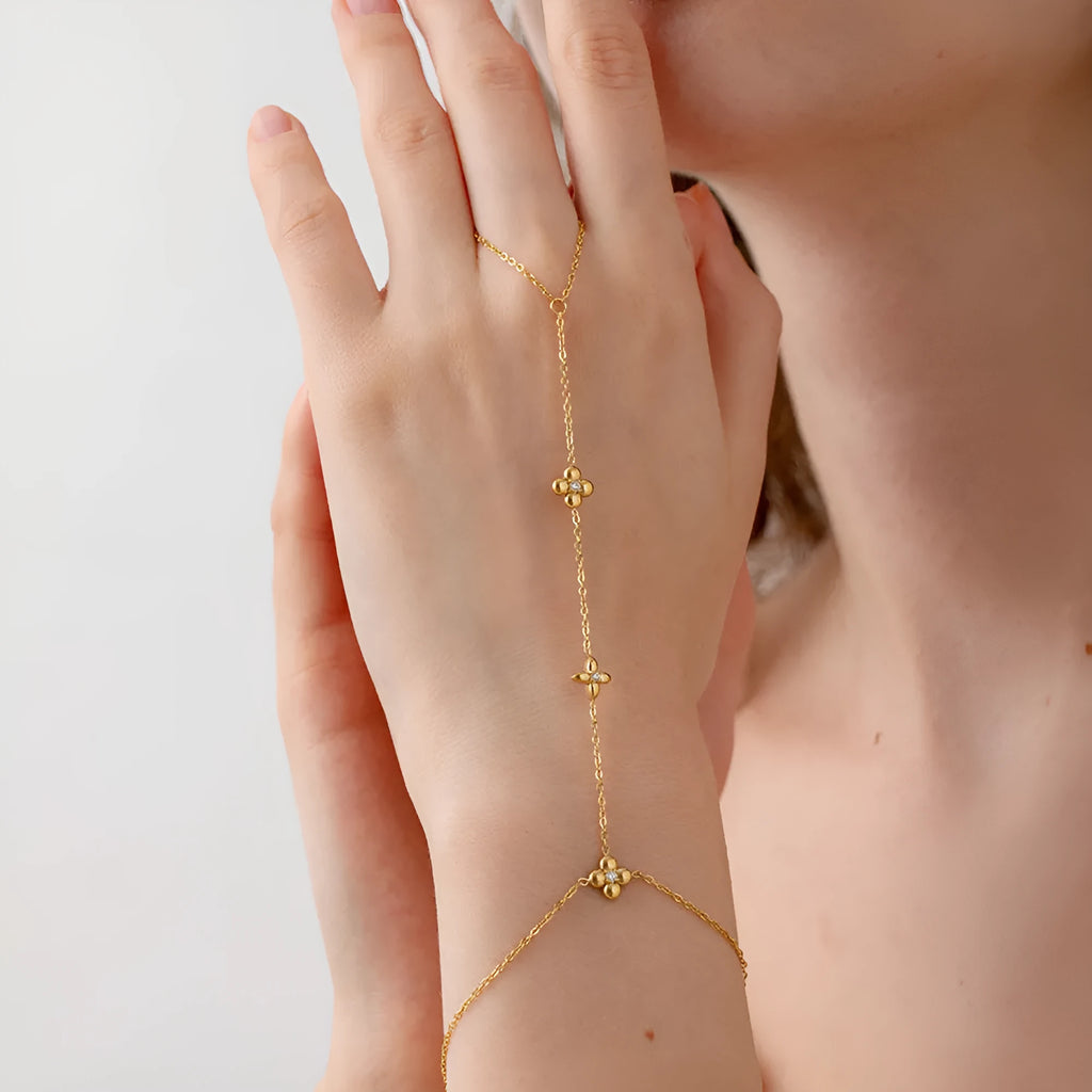 Gold stainless steel women's bracelet with flower and octagonal star geometric designs