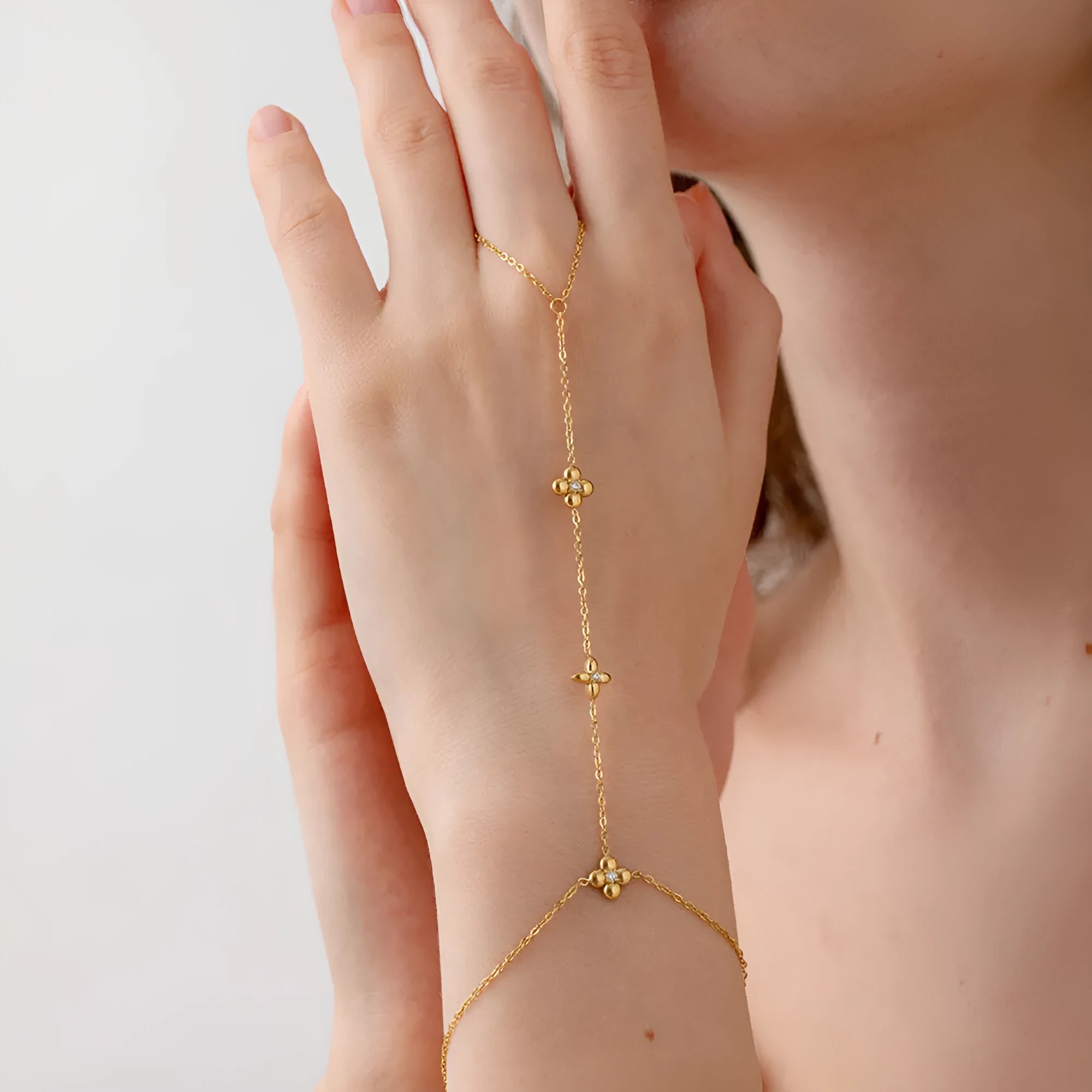 Gold stainless steel women's bracelet with flower and octagonal star geometric designs