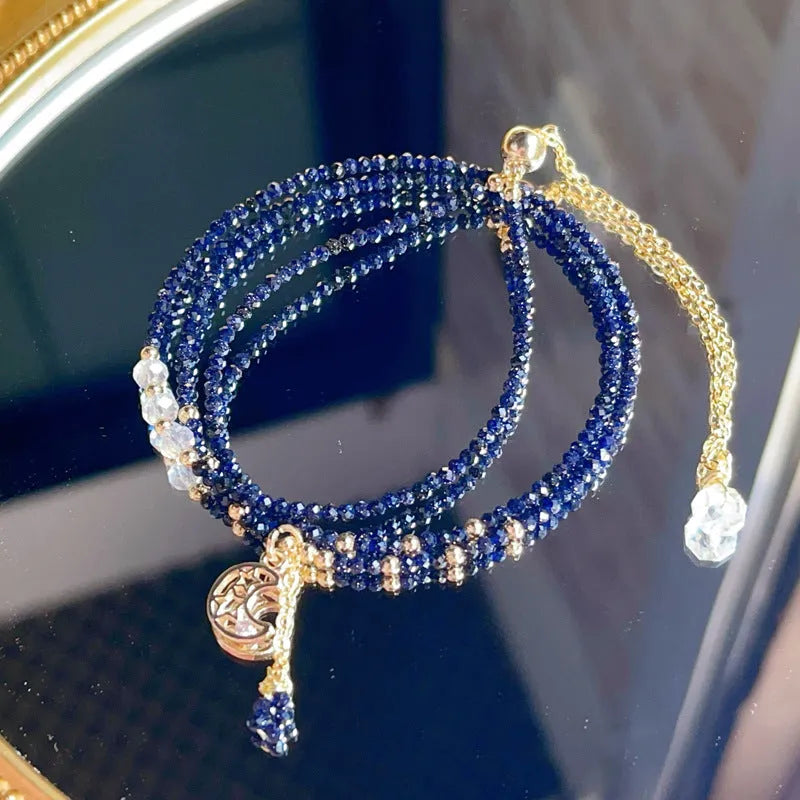 Blue and gold three-ring women's bracelet with sand stone cut beads showing manual processing texture details