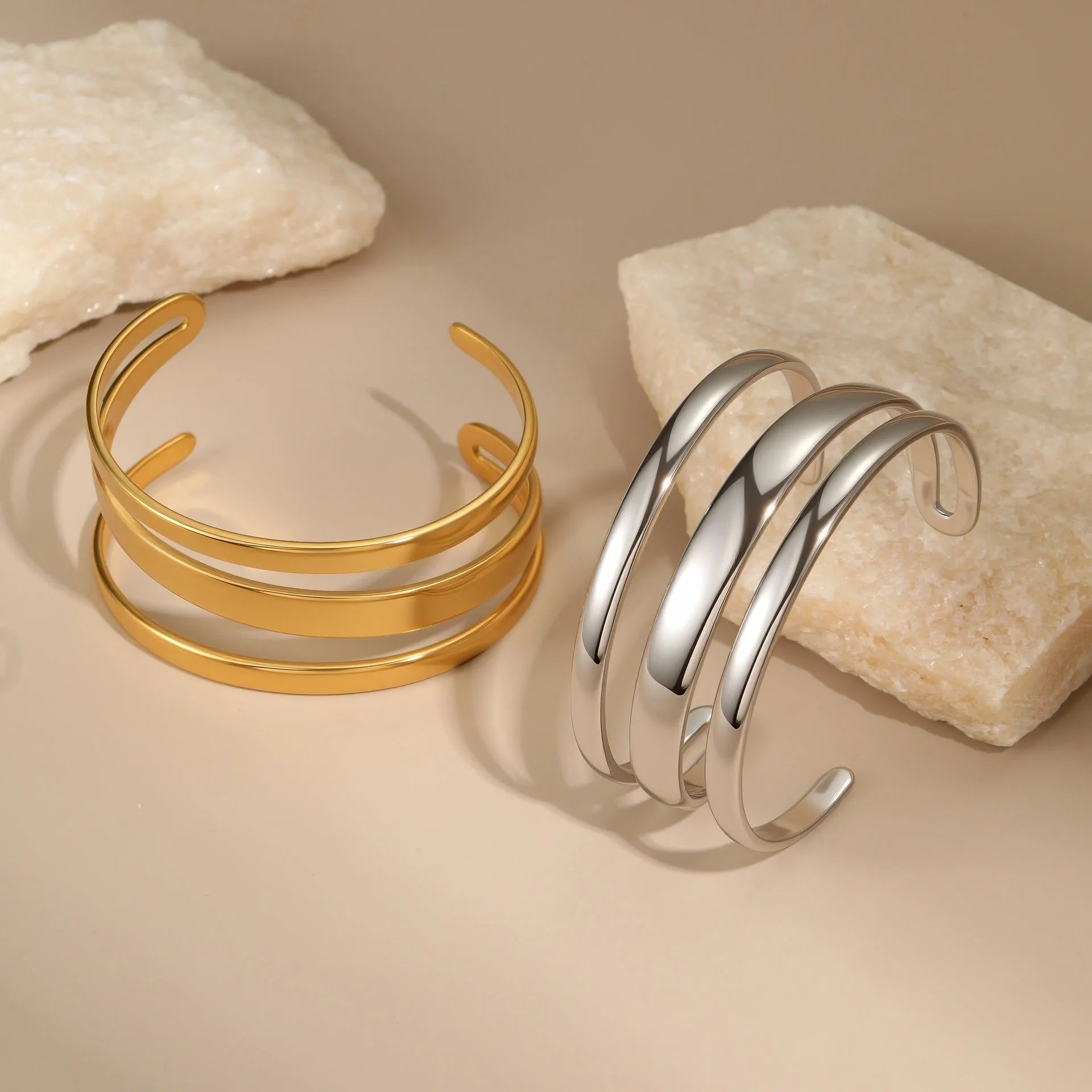 Stainless steel opening bracelet for women in gold or steel finish with geometric line design