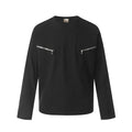 A loose-fitting long sleeve cotton pullover in grey, shown on a model for casual wear.