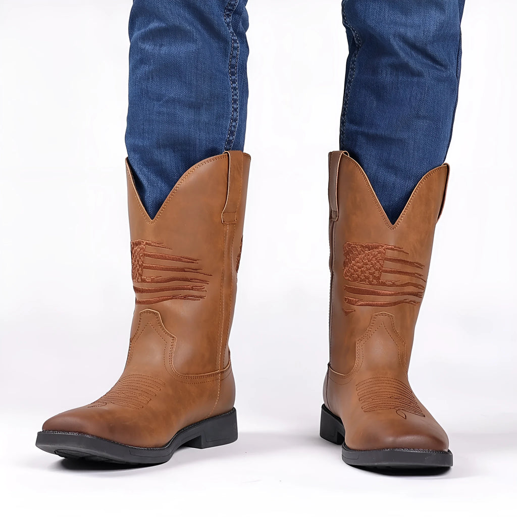 Men's brown retro cowboy boots with wide square toe, horseshoe heel, and embroidered sewing thread detailing on upper