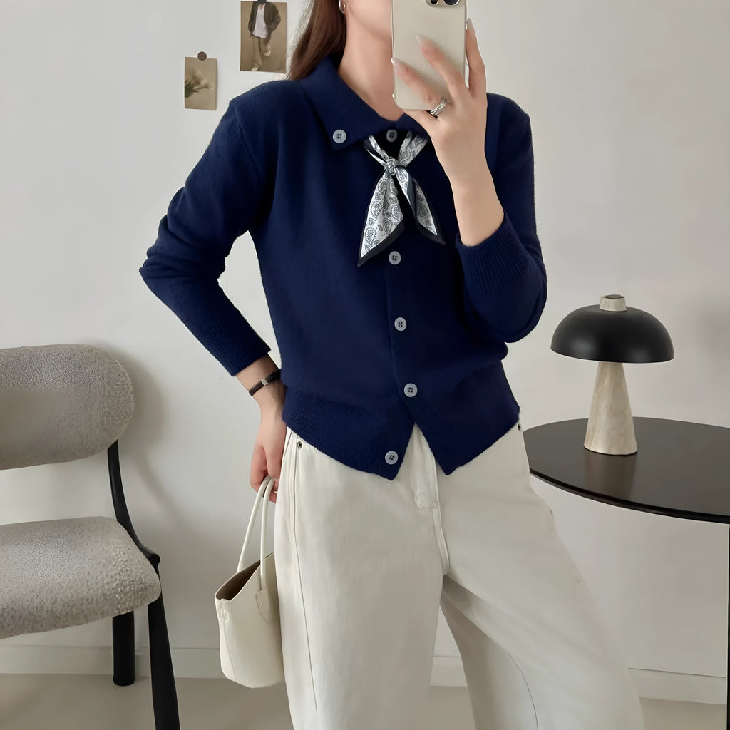 Women's beige cardigan sweater with a built-in lapel scarf collar and long sleeves.
