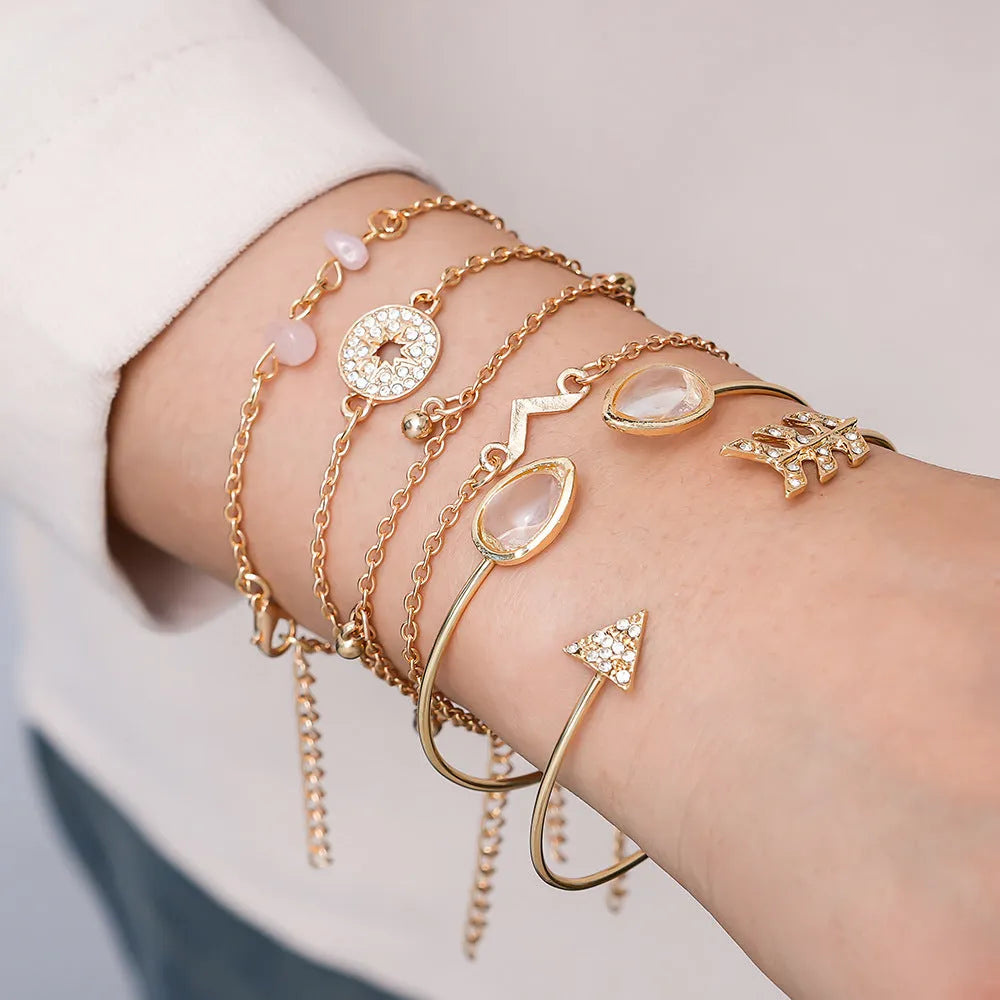 Six-piece zinc alloy women's bracelet set with golden spots, drill arrows, water droplets, and V-shaped links