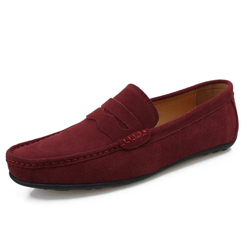 Men's solid-colour suede loafers with a round toe and flat rubber sole.