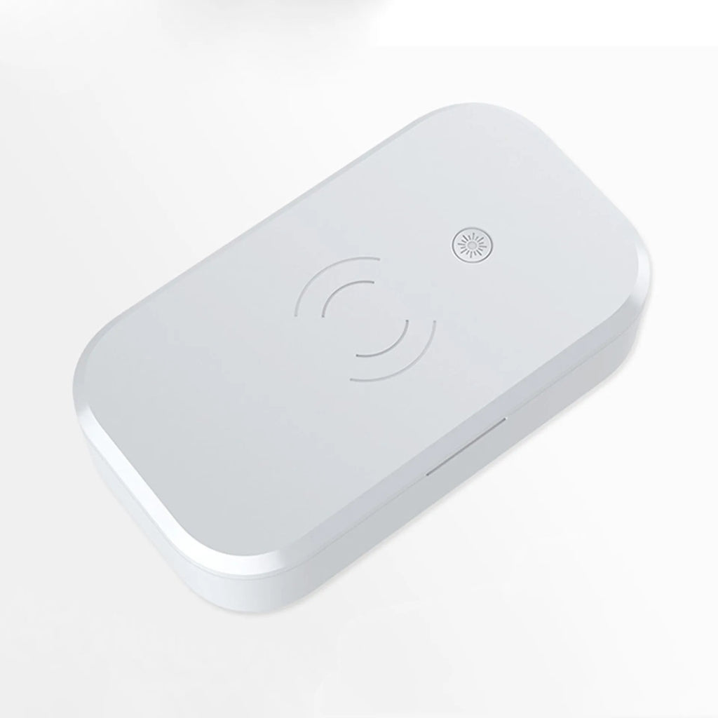 A white multifunctional UV disinfection box with wireless charging for mobile phones and nail art tools.