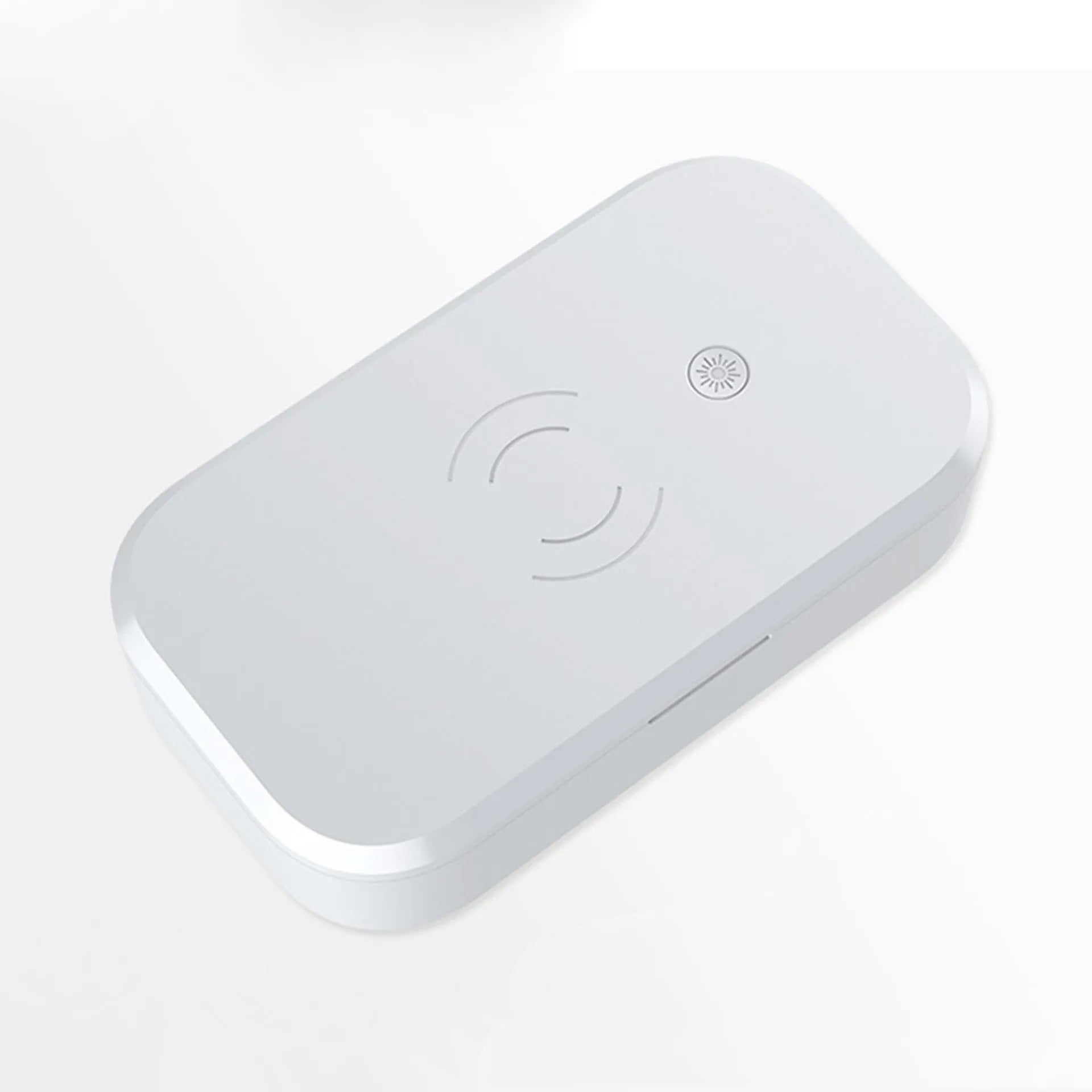 A white multifunctional UV disinfection box with wireless charging for mobile phones and nail art tools.