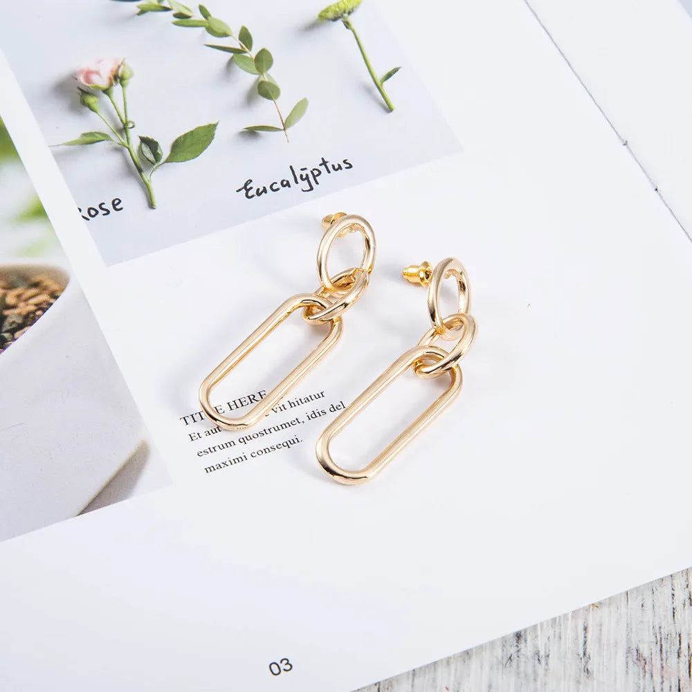 Geometric sterling silver needle hoop earrings with ring and line elements for women