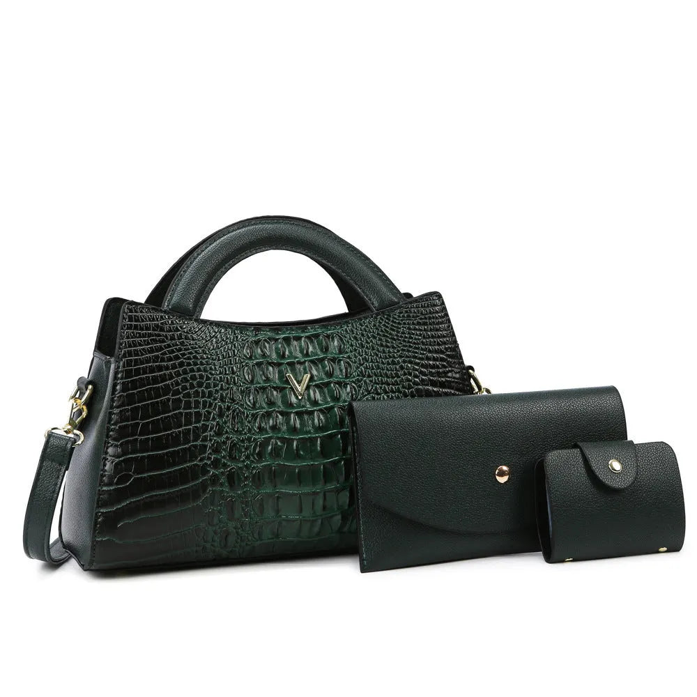 Square black women's crossbody bag with crocodile pattern texture and a single shoulder strap.