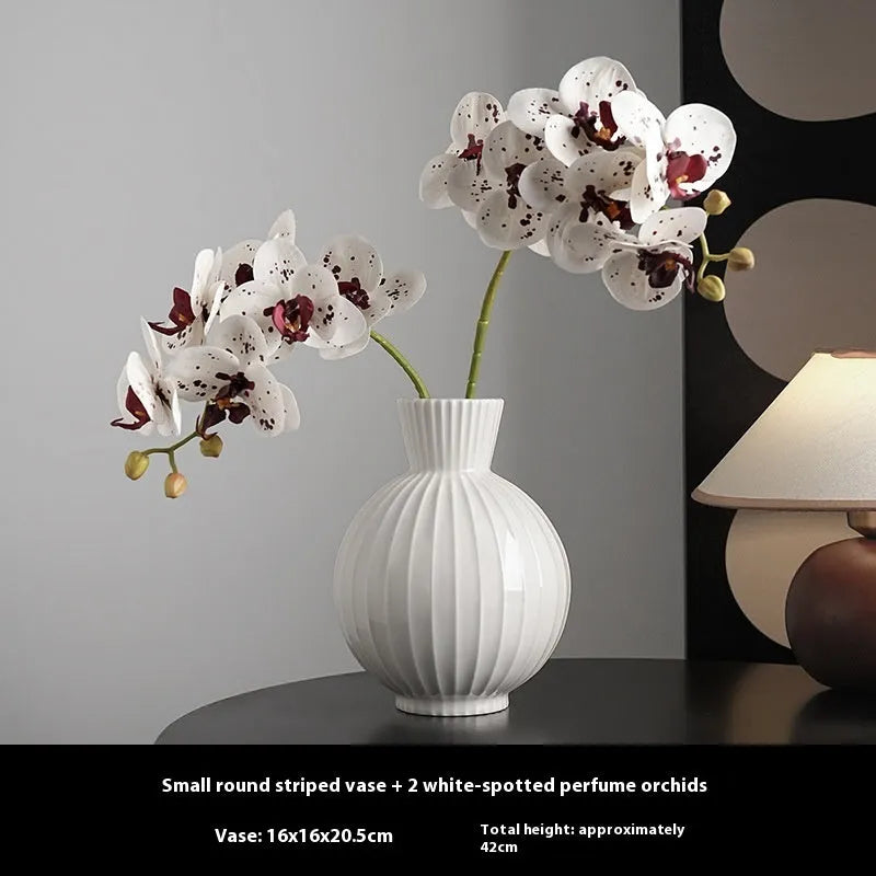 White ceramic ball vase with stripes, American country style, shown on a table.