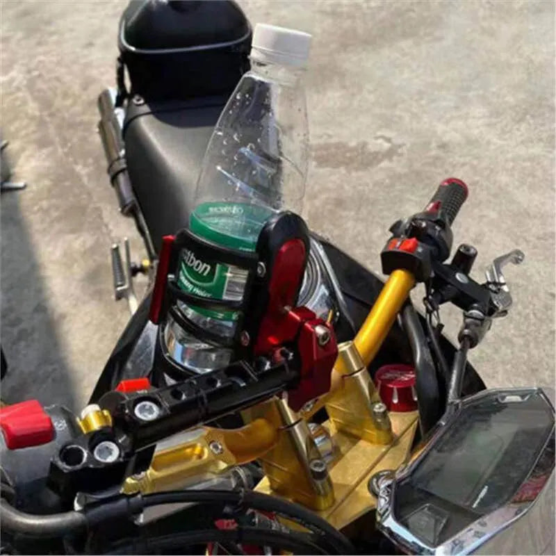Black plastic water bottle cage mounted on Honda X-ADV scooter modified bumper