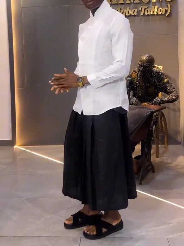 White asymmetric long sleeve shirt and black pleated pants set on model, regular fit, casual daily wear