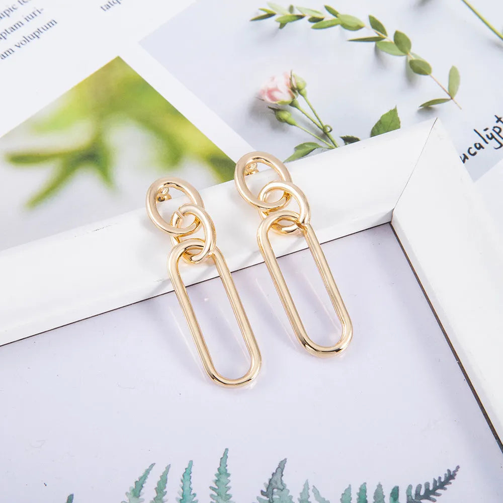 Geometric sterling silver needle hoop earrings with ring and line elements for women
