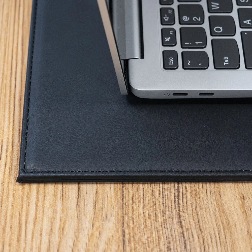 Soft PVC heat-insulating anti-radiation pad for laptops in black, blue, green, and black gold colours.