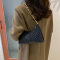 Brown pleated PU leather vertical square shoulder bag with a chain strap and soft handle.