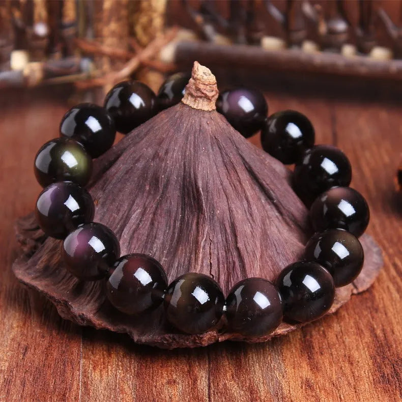 Polished natural icy obsidian Pi Xiu bracelet with ethnic geometric design