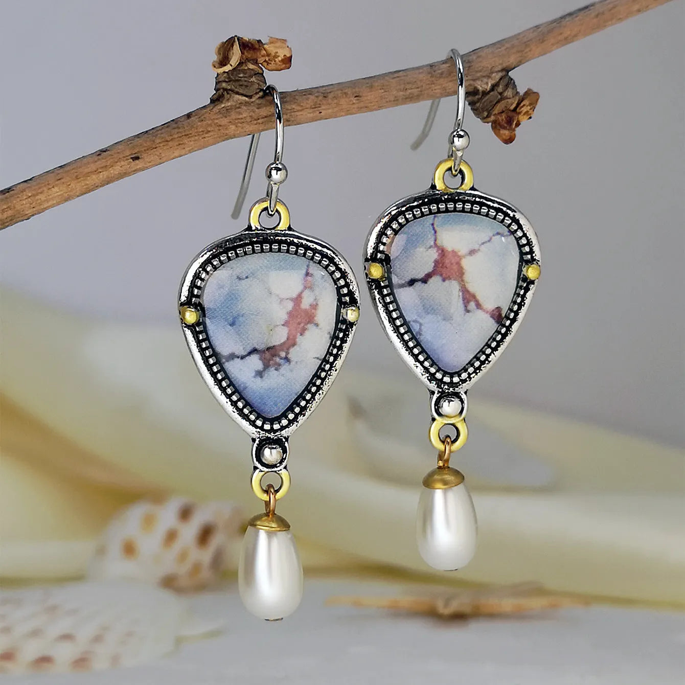 Retro blue electroplated drop earrings with synthetic blue opal and white pearl accents, Bohemian geometric design.