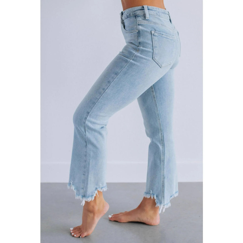 Women's casual denim jeans in solid dark blue with a hand-worn distressed finish.
