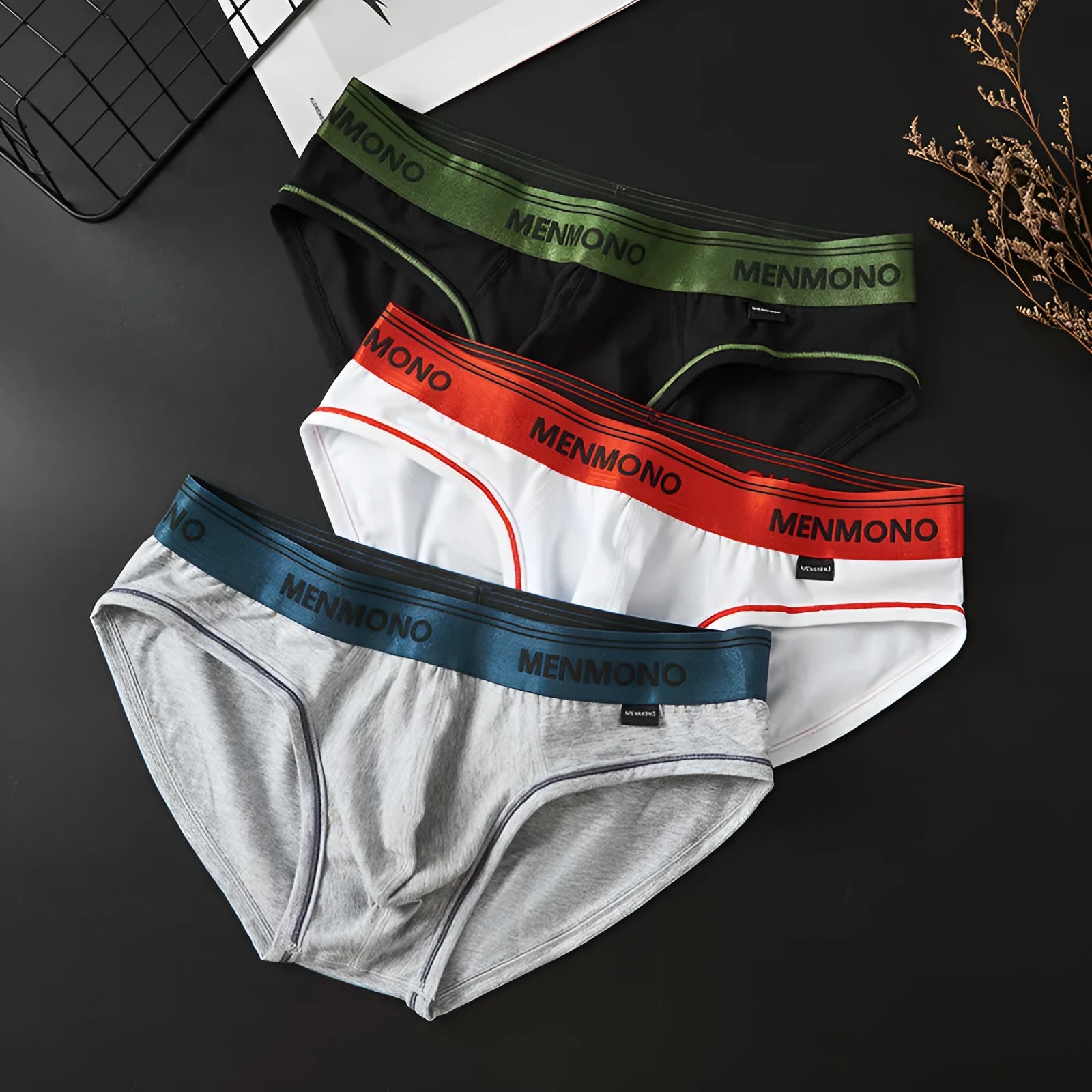 Men's cotton low waist briefs in two-tone colour combinations showing solid colour design