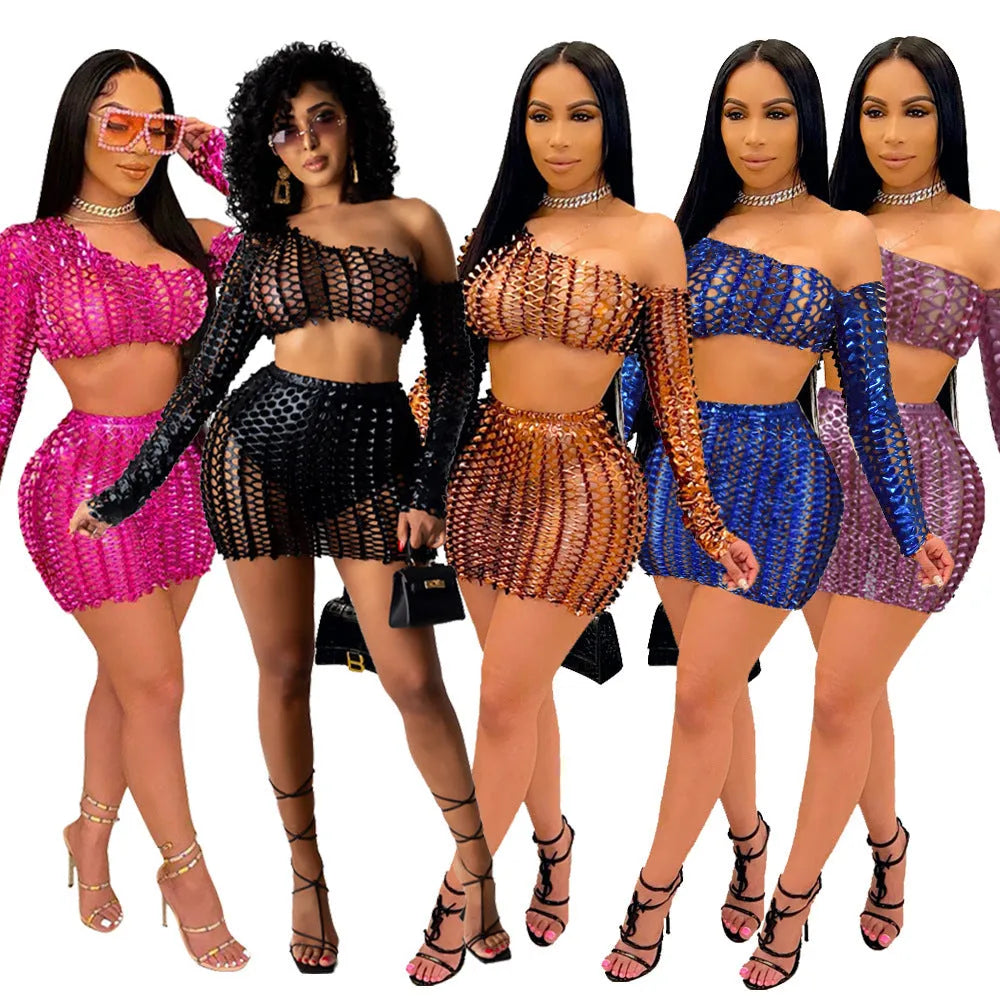 Women's black two-piece dress set with sleeveless hollow-out net top and matching short skirt.