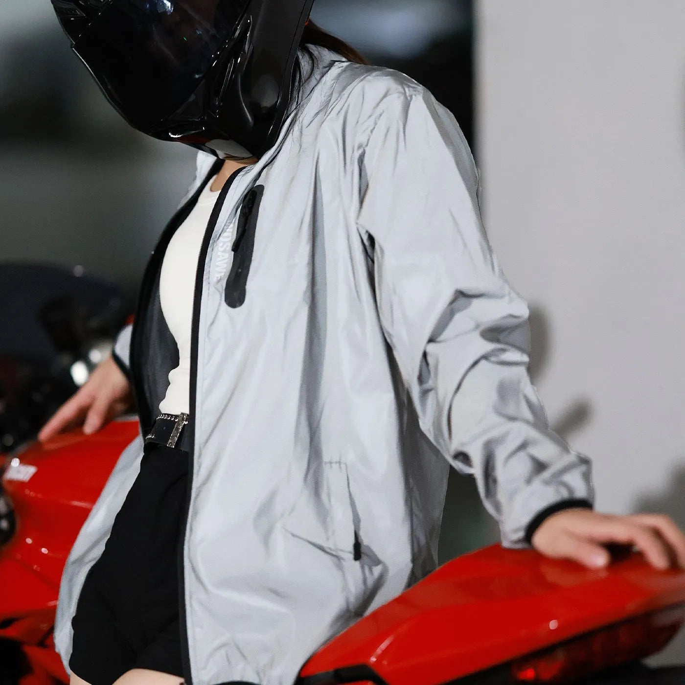 Silver waterproof polyester windproof coat with long sleeves showing Asian and European sizing labels