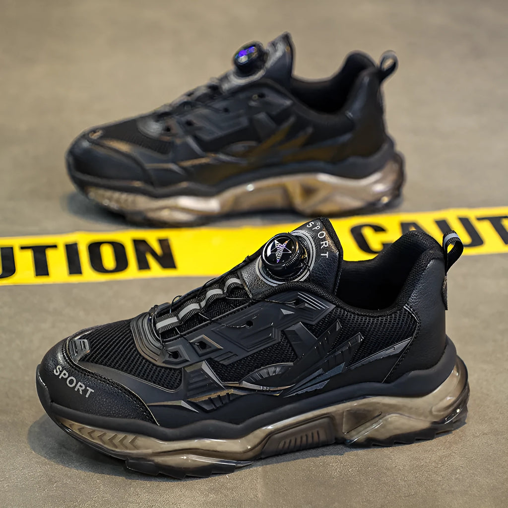 Men's black mesh casual sneakers with a rotating button closure and a low platform sole.
