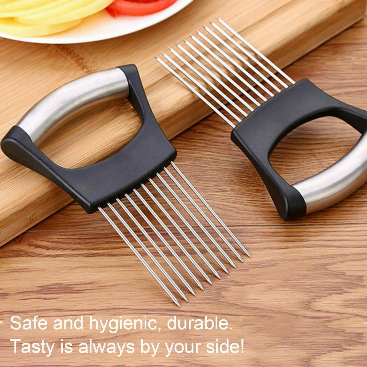Stainless steel onion holder slicer with non-slip base on a kitchen counter, holding a tomato for slicing