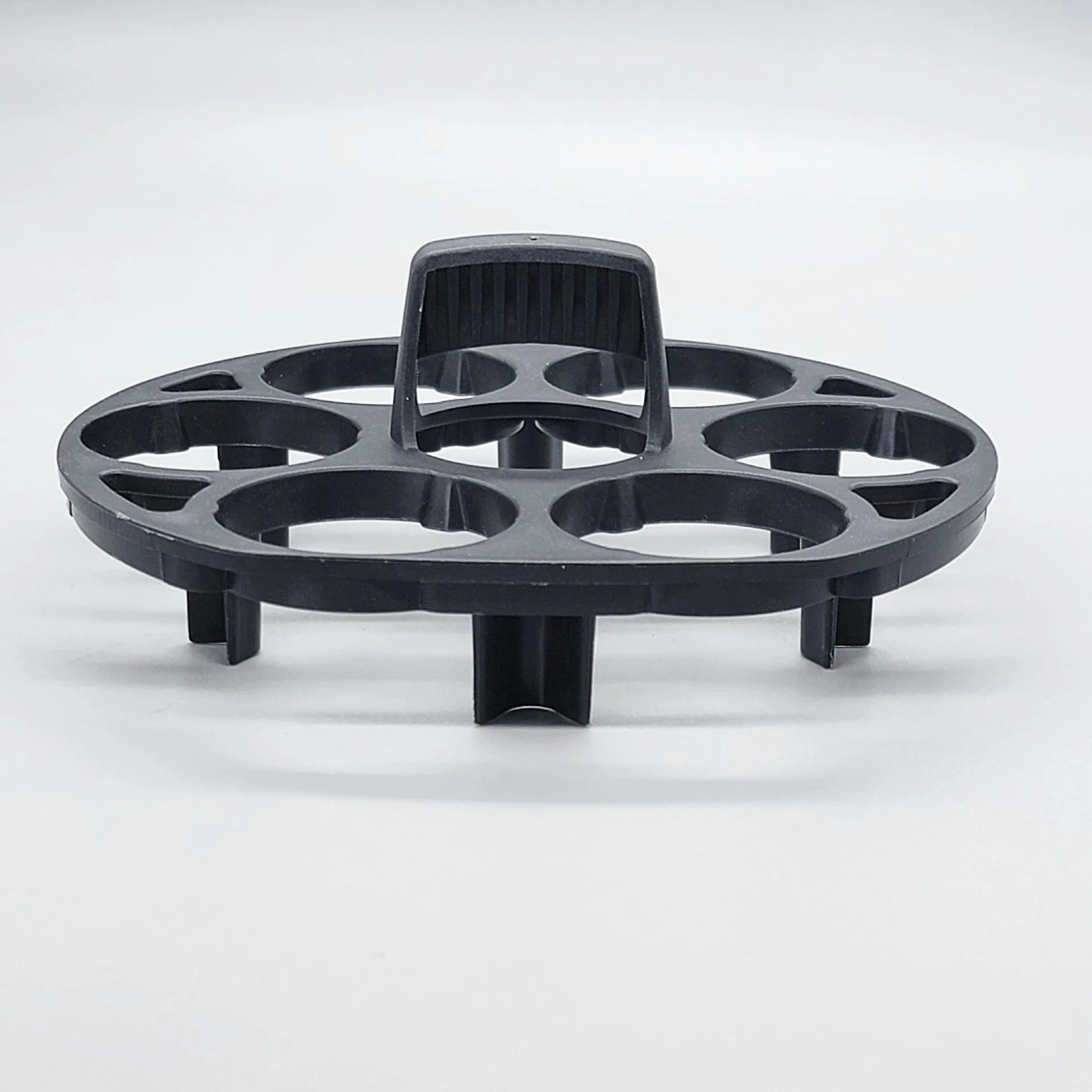 Black plastic egg holder rack with individual compartments measuring 13.8cm wide