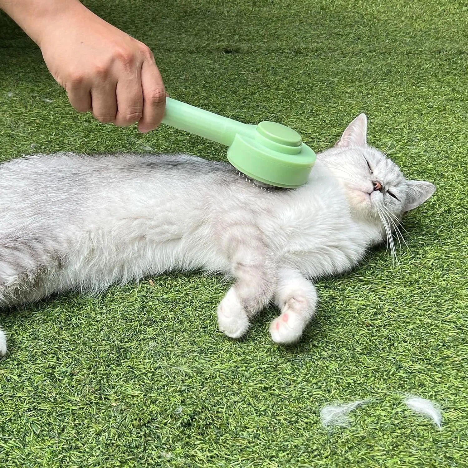 Green and yellow pet grooming brush with stainless steel teeth for cats and dogs
