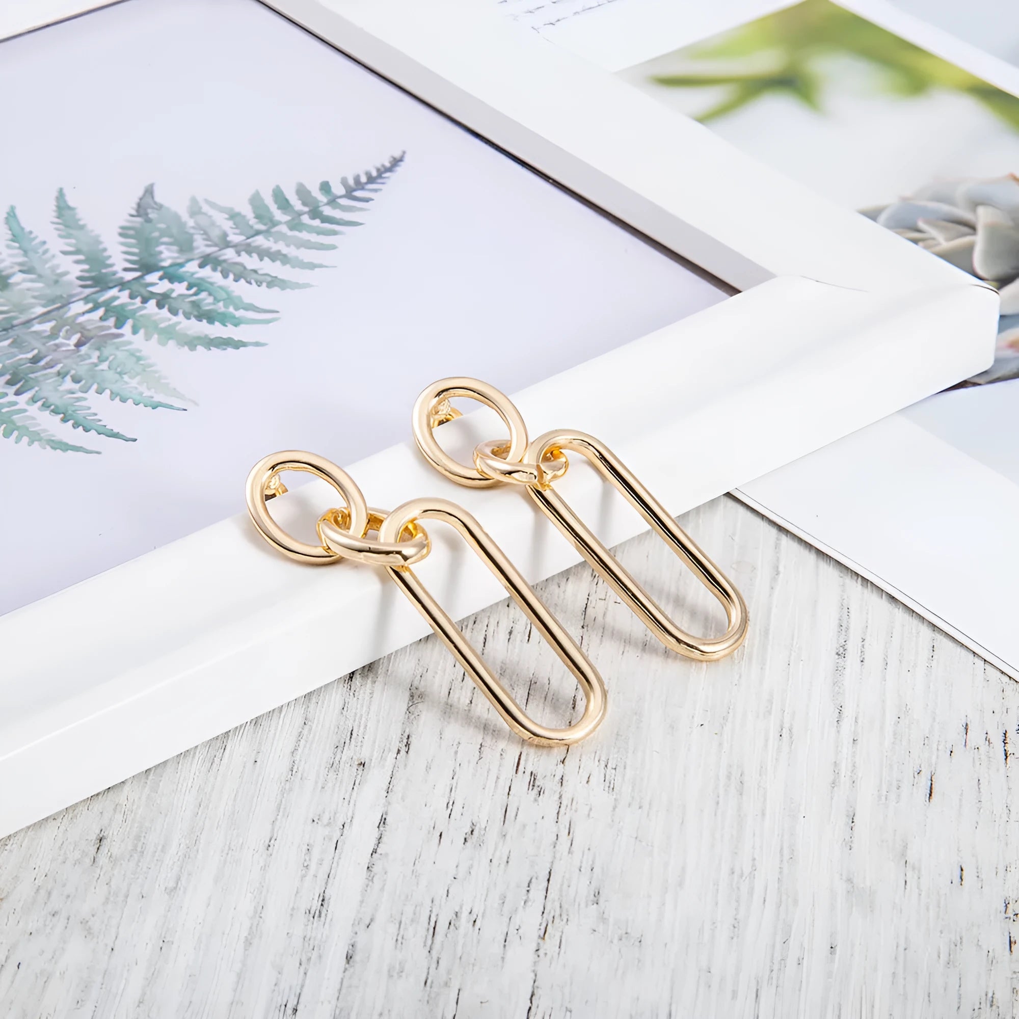 Geometric sterling silver needle hoop earrings with ring and line elements for women