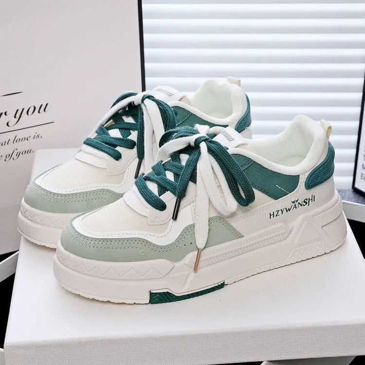 Children's beige height increasing trainers with thick rubber sole, lace-up front, and cross shoulder straps.