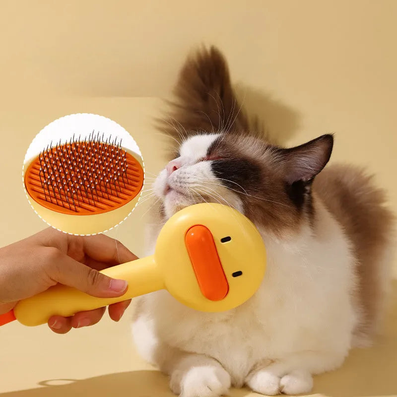 Yellow duck-shaped pet comb with open-section design and floating needle teeth for cat and dog grooming