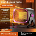 White desktop electric fan heater with push-button controls and a rotatable base on a wooden table.