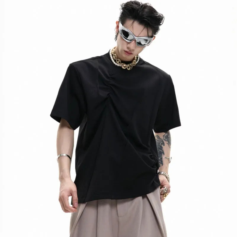 Men's loose fit grey cotton T-shirt with pleated detail and asymmetric stitching on a short sleeve.