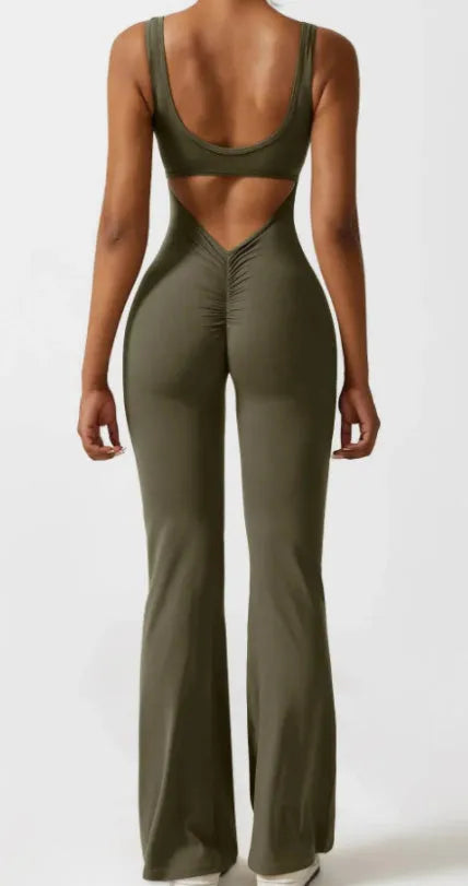 Women's black seamless yoga bodysuit jumpsuit with mid waist and trousers length.