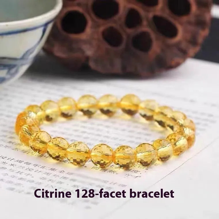 Handcrafted unisex crystal bracelet with 128-facet beads in amethyst, available in multiple bead diameters.