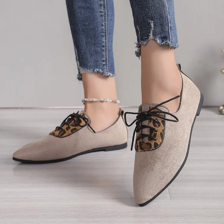 Beige leopard print women's plus size pointed toe pumps with a faux PU upper and rubber sole.