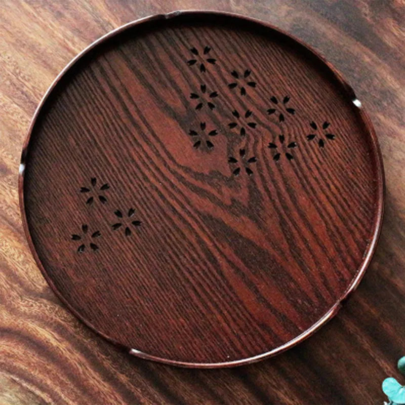 Wooden shallow plate with hollow sakura cherry blossom design, 30 cm diameter, for dessert serving.